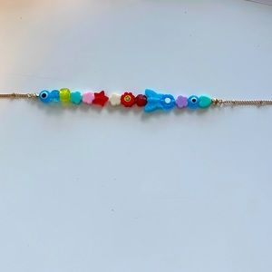 Multiple colored necklaces, kid/indie core